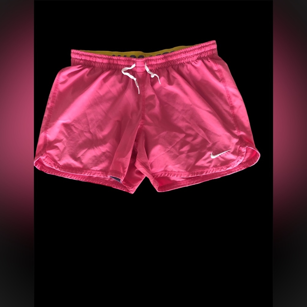 Pink and yellow Nike shorts. Used. Size small.